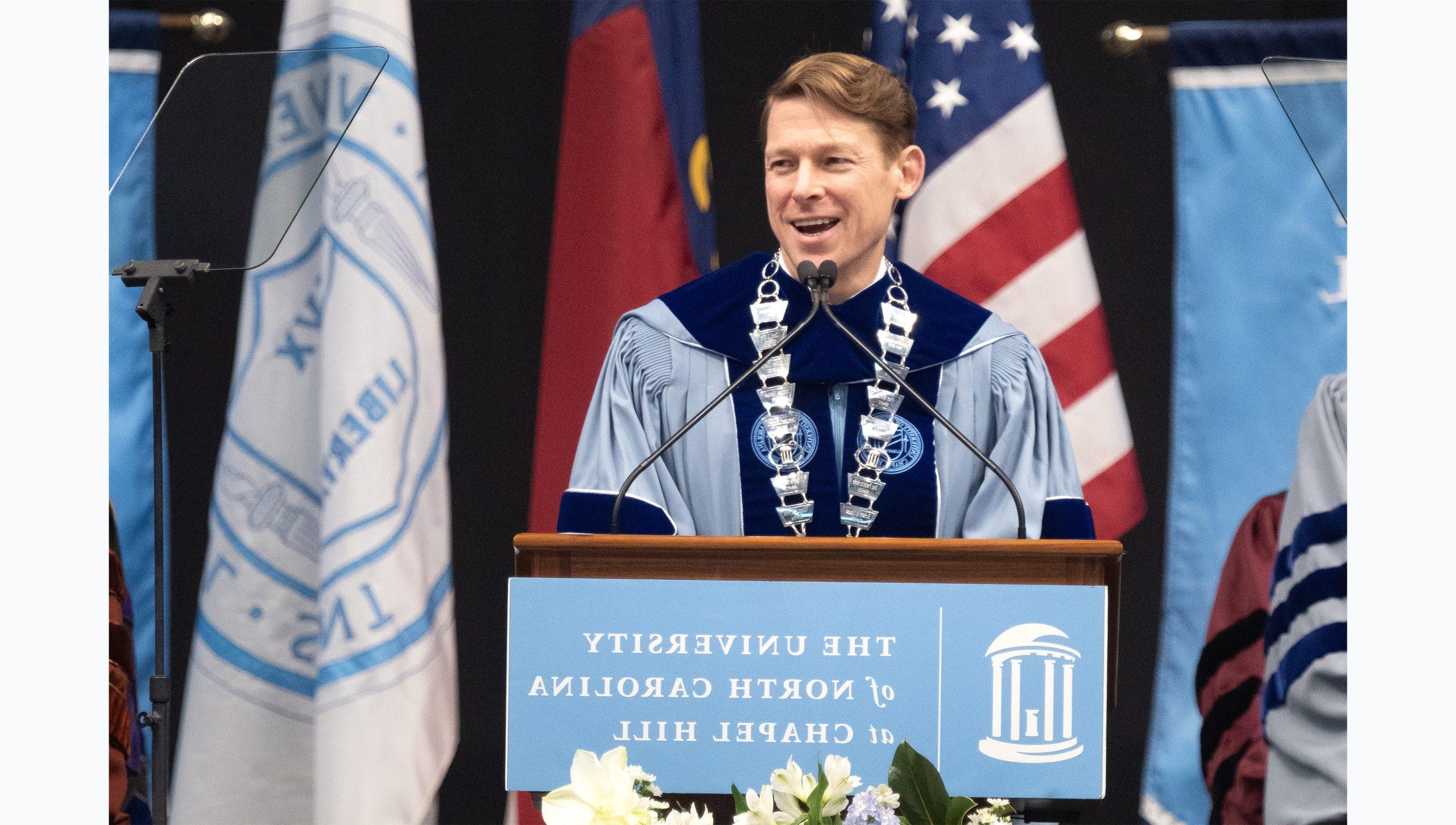 Chancellor Lee H. Roberts speaking from a podium at U.N.C. Chapel Hill's Winter Commencement